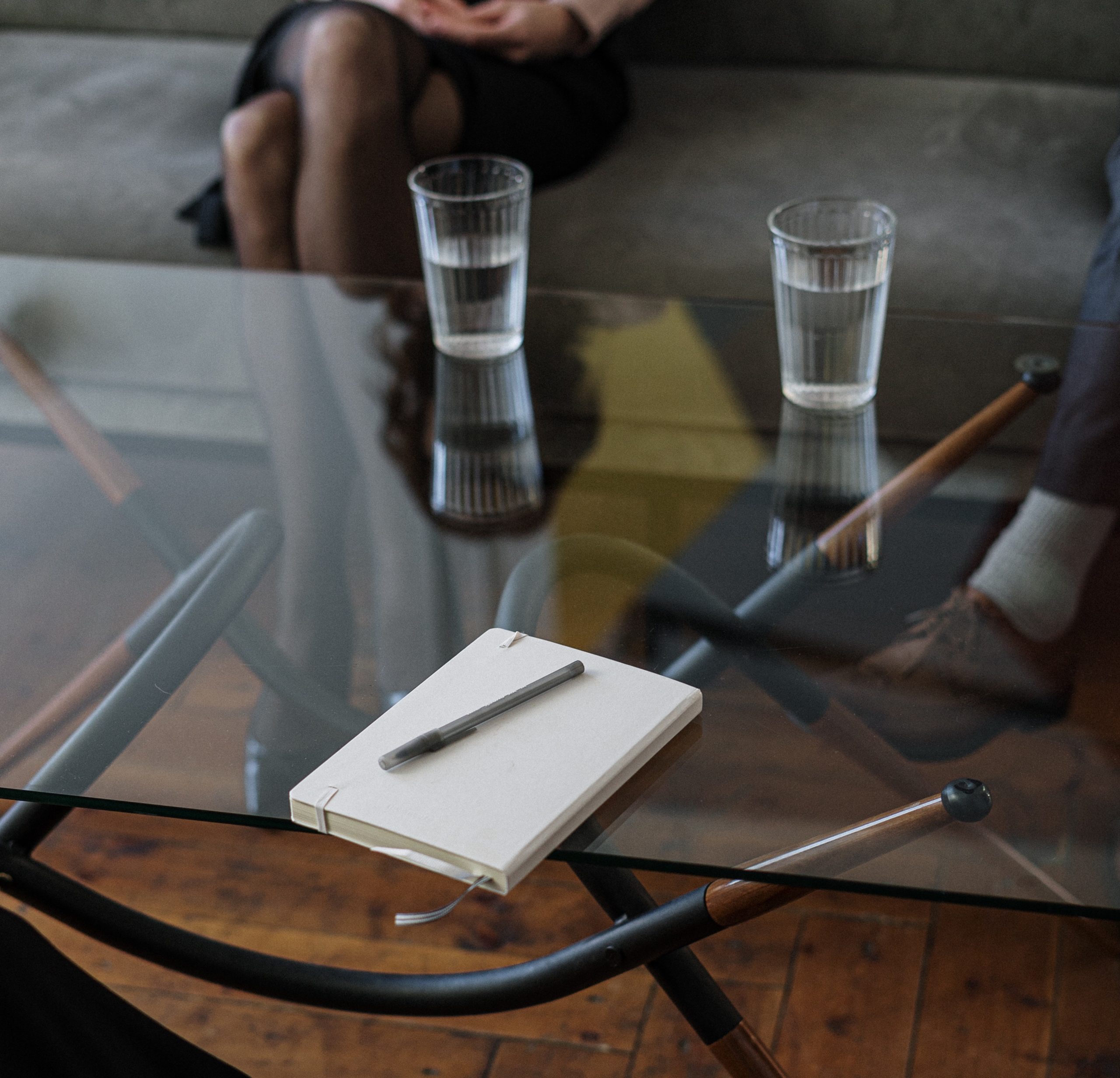 white-and-silver-chair-beside-clear-drinking-glass-on-glass-4098232